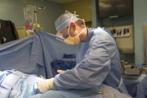 A doctor Is operating a Orthopedic Surgery