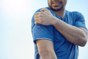 cropped image of a man experiencing pain from a slap tear
