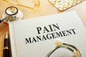 Book about Pain management. Chronic care management concept.