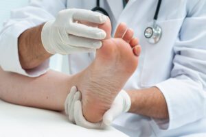 Podiatrist checking Patient's foot