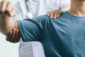 A man with shoulder pain goes to the doctor